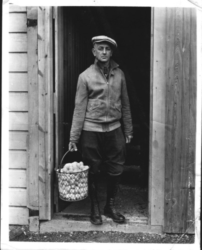 Don Barrell dressed up with eggs. Don lived and worked on the Bairdlea Farm in Sugar Loaf, New York. Circa 1920. chs-001010